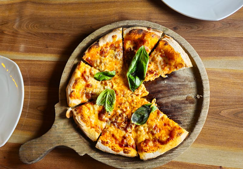 Margherita pizza with fresh basil and mozzarella